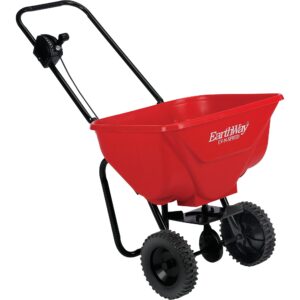 Photo of Earthway Spreader 2030. Looks like frame with wheels and red bucket attached to top with hole in bottom.