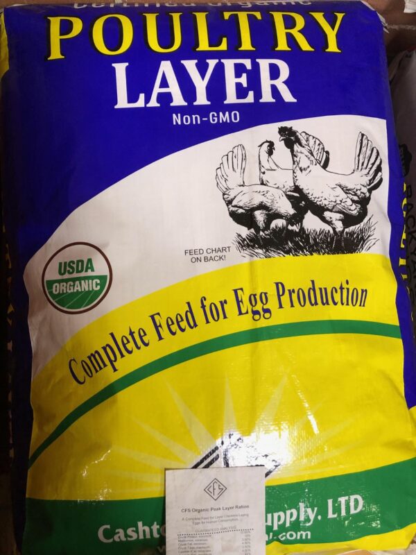 Photo of Certified Organic Chicken Layer. Packaging is blue, yellow, and green.