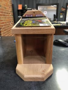 Photo of Squirrel Munch Box in wood with plexiglass piece on front and small gap at top.